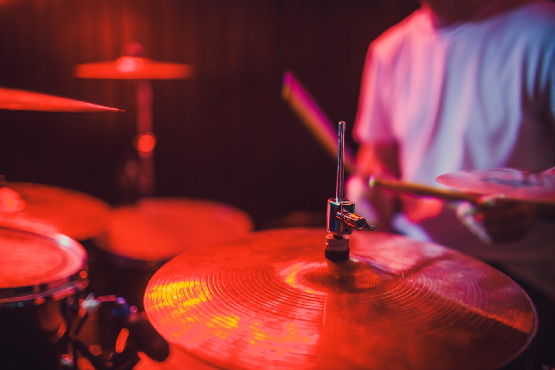 Talented drum player performing at a live gig on a pub venue